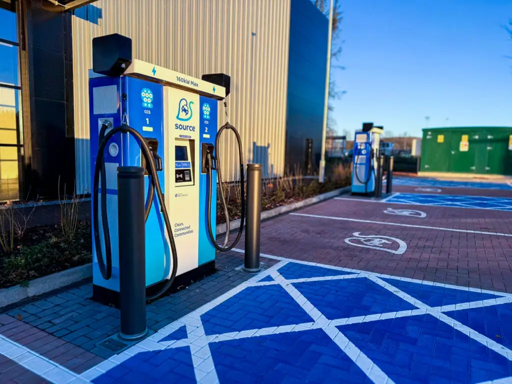 Source 160kW ultra-rapid EV charging station Springkerse Industrial Estate Stirling - ten-bay facility with blue branded chargers, dedicated EV parking, contactless payment, 24/7 support for fleet and public charging