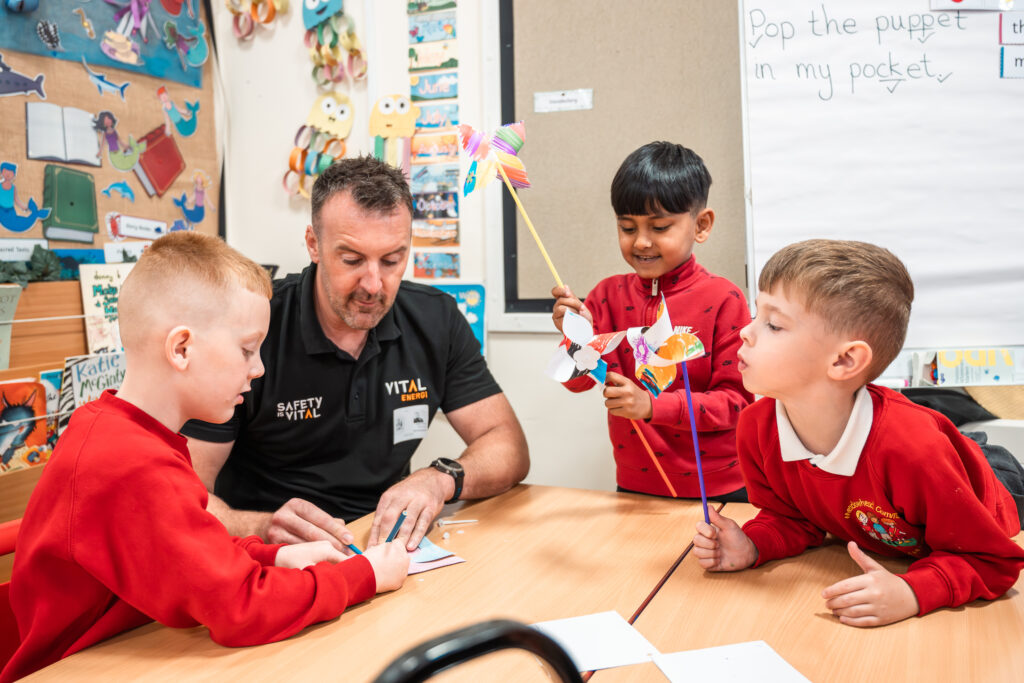 "Vital Energi employee volunteering with pupils at a local primary school"