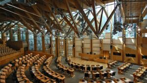 Interior of the Scottish Parliament debating chamber in Edinburgh, featured in Hot Tin Roof's PR agency analysis of the Programme for Government for robotics, life sciences and energy.