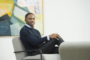 Daniel Muranda, Principal at SEP, seated in an office armchair, commenting on the IntelliSense.io SEP investment in a release covered by Hot Tin Roof, PR agency for deep tech and energy.
